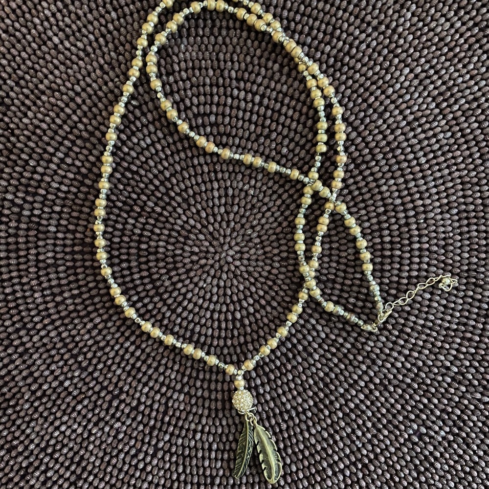 Layered (long) beaded necklace with feather charm